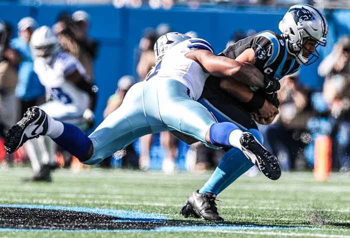 Parsons brings down Young during Sunday's game.